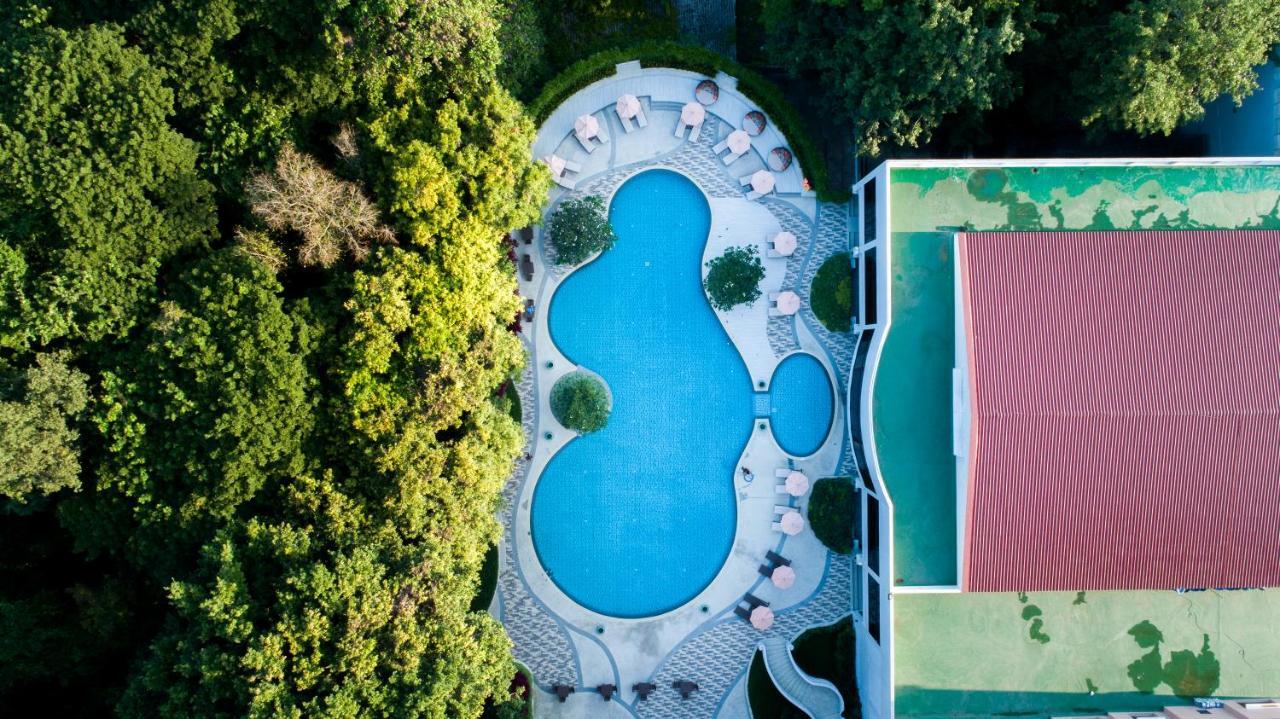 The Heritage Chiang Rai Hotel And Convention Exterior photo Aerial view of the swimming pool